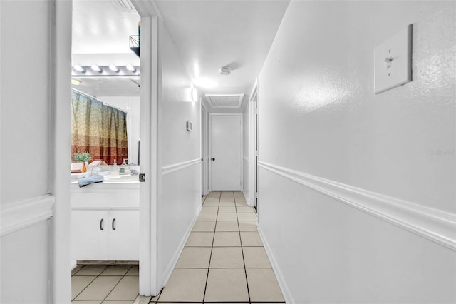 8115 N Ola Ave, Tampa, FL 33604 - hall with light tile patterned floors and attic access