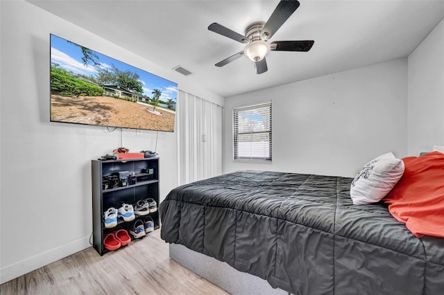 8115 N Ola Ave, Tampa, FL 33604 - bedroom with ceiling fan, visible vents, baseboards, and wood finished floors