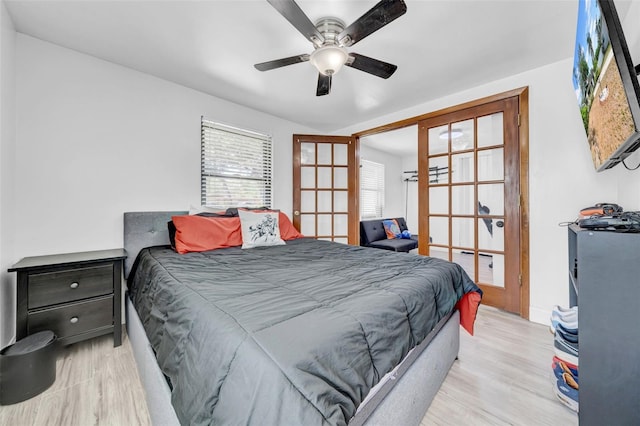 8115 N Ola Ave, Tampa, FL 33604 - bedroom featuring french doors, a ceiling fan, and wood finished floors