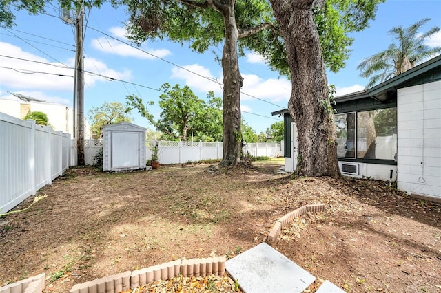 8115 N Ola Ave, Tampa, FL 33604 - view of yard featuring an outbuilding, a storage unit, and a fenced backyard
