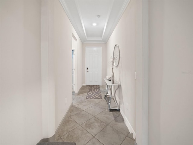 hall with recessed lighting, baseboards, ornamental molding, and light tile patterned floors