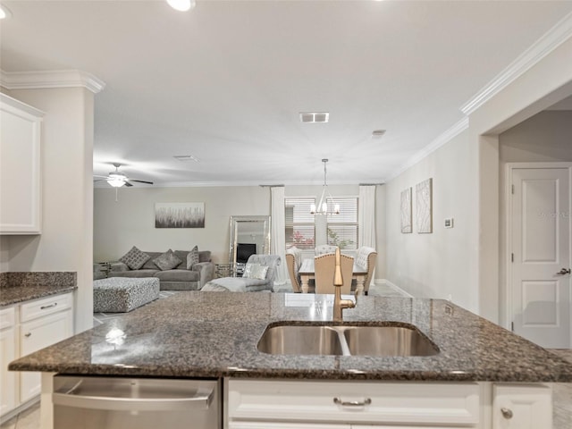 kitchen with visible vents, crown molding, white cabinetry, a sink, and dishwasher