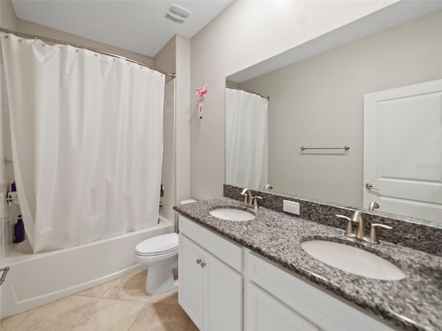 bathroom featuring a sink, toilet, shower / bathtub combination with curtain, and double vanity