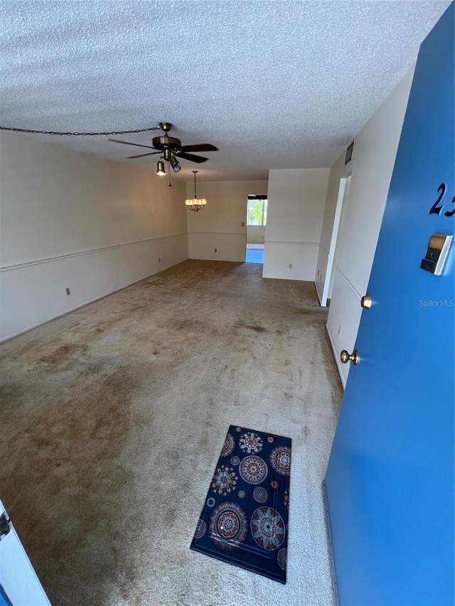 4715 Bay St NE Unit 235, Saint Petersburg, FL 33703 - carpeted empty room with a textured ceiling and a ceiling fan