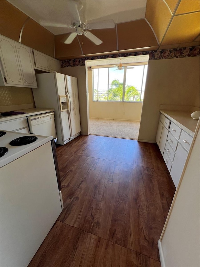 4715 Bay St NE Unit 235, Saint Petersburg, FL 33703 - kitchen featuring range, dark wood-style floors, light countertops, a ceiling fan, and white cabinets