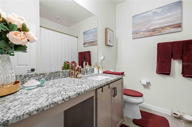 bathroom featuring baseboards, a shower with curtain, toilet, vanity, and tile patterned floors