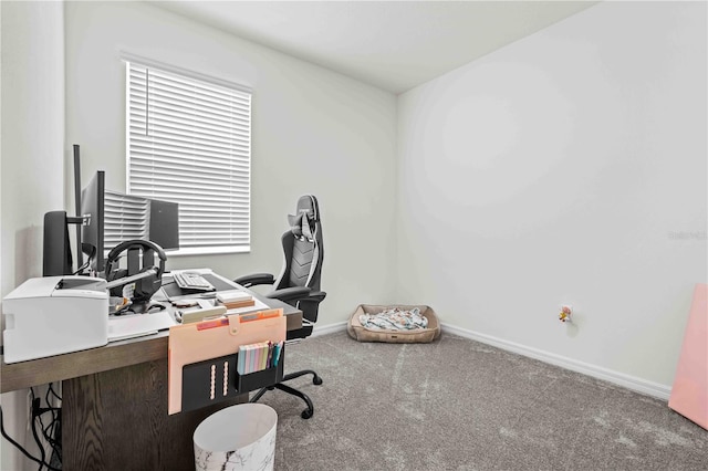 carpeted home office with baseboards