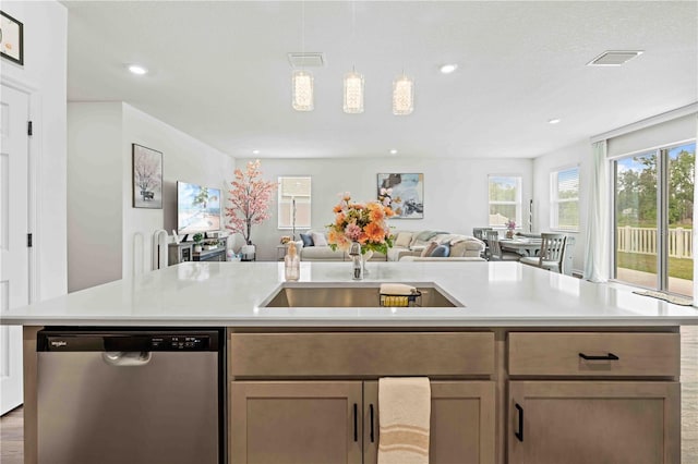 kitchen featuring visible vents, recessed lighting, dishwasher, light countertops, and open floor plan