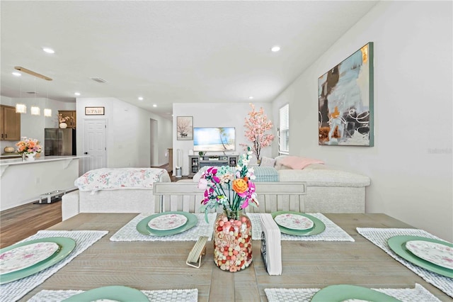 dining room featuring recessed lighting and wood finished floors