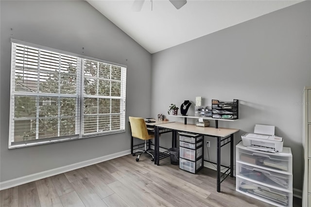 office with baseboards, vaulted ceiling, a ceiling fan, and wood finished floors