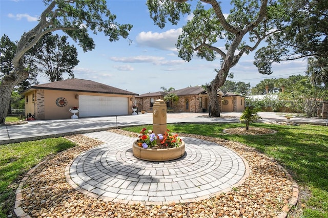6732 Udell Ln, Hudson, FL 34667 - view of front of property with curved driveway, an outdoor structure, and a garage