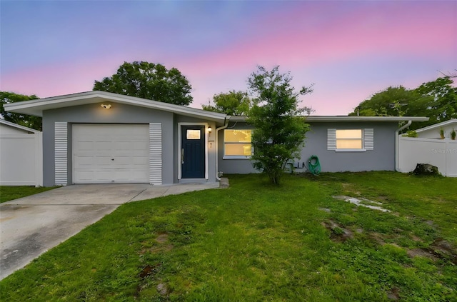 2401 Havana Dr, Clearwater, FL 33764 - ranch-style home with a yard, fence, concrete driveway, and stucco siding