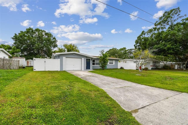 2401 Havana Dr, Clearwater, FL 33764 - view of front of property featuring fence, a front lawn, a gate, an attached garage, and concrete driveway