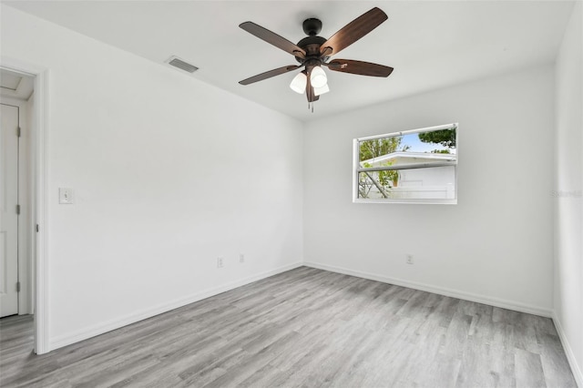 2401 Havana Dr, Clearwater, FL 33764 - empty room featuring wood finished floors, baseboards, a ceiling fan, and visible vents