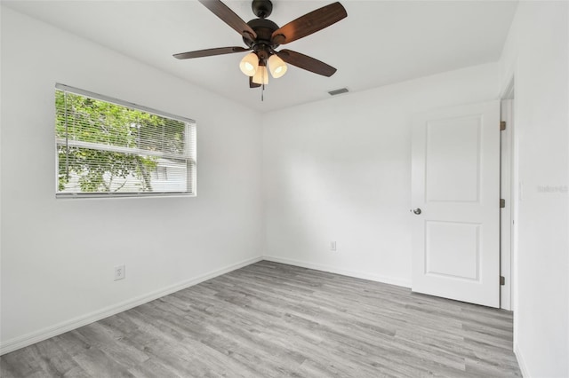 2401 Havana Dr, Clearwater, FL 33764 - unfurnished room with visible vents, baseboards, light wood-type flooring, and a ceiling fan