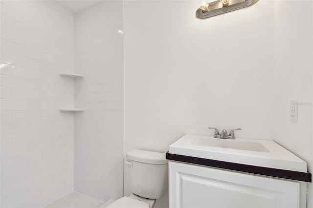 2401 Havana Dr, Clearwater, FL 33764 - full bathroom with vanity, a tile shower, and toilet