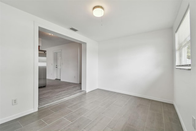 2401 Havana Dr, Clearwater, FL 33764 - empty room featuring wood finish floors, baseboards, and visible vents
