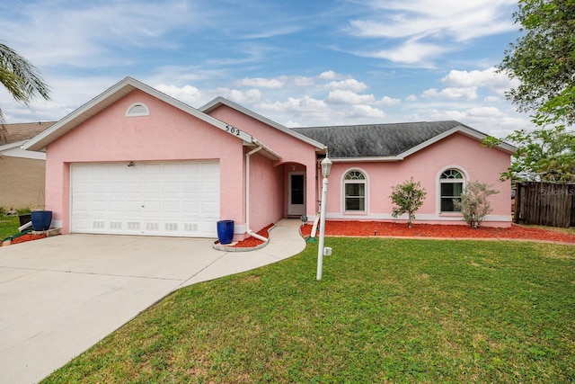 502 36th St W, Palmetto, FL 34221 - ranch-style home with stucco siding, driveway, a front lawn, a garage, and fence