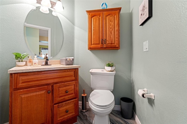 3434 Tarbolton Way, Land O Lakes, FL 34638 - half bath with baseboards, wood finished floors, vanity, and toilet