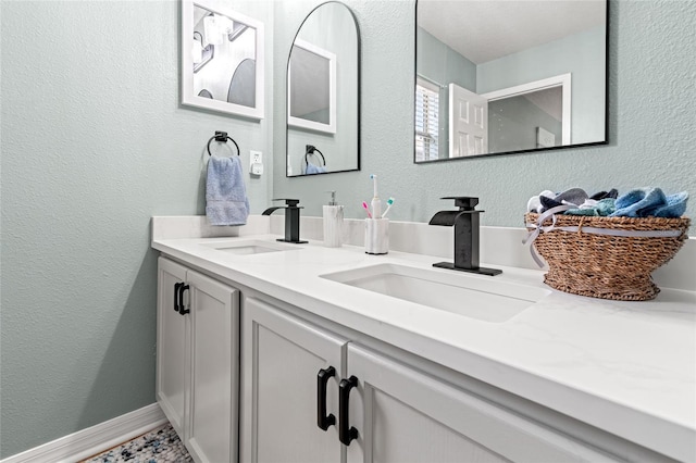 3434 Tarbolton Way, Land O Lakes, FL 34638 - bathroom with a textured wall, a sink, and double vanity