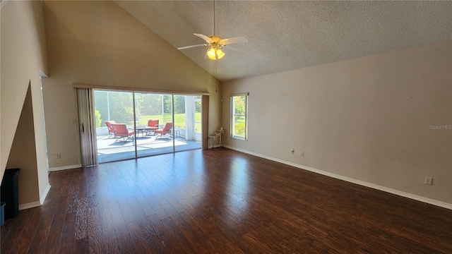 empty room with baseboards, dark wood-style floors, a textured ceiling, ceiling fan, and high vaulted ceiling