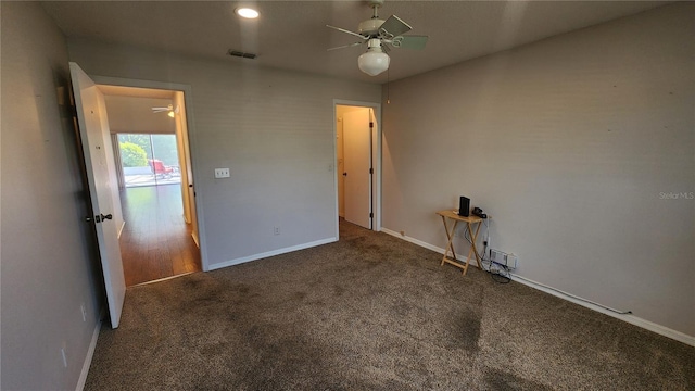 unfurnished bedroom featuring visible vents, baseboards, a ceiling fan, and carpet