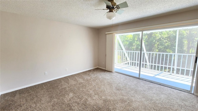 unfurnished room featuring carpet floors, ceiling fan, baseboards, and a textured ceiling