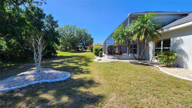 view of yard with glass enclosure
