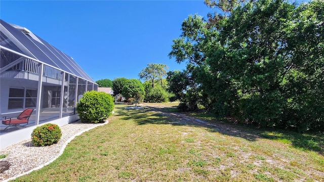 view of yard with a lanai