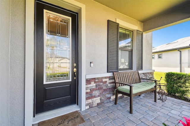 19325 Hawk Valley Dr, Tampa, FL 33647 - entrance to property with stucco siding and a porch