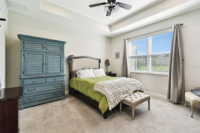 19325 Hawk Valley Dr, Tampa, FL 33647 - bedroom with baseboards, visible vents, a raised ceiling, and light colored carpet