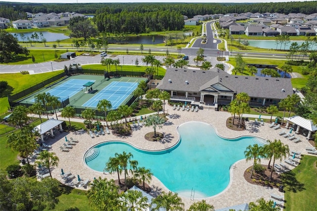 19325 Hawk Valley Dr, Tampa, FL 33647 - view of swimming pool featuring a water view and a residential view