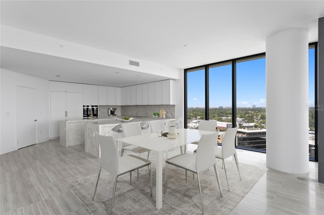 2912 W Santiago St Unit 1401, Tampa, FL 33629 - dining space featuring visible vents and expansive windows