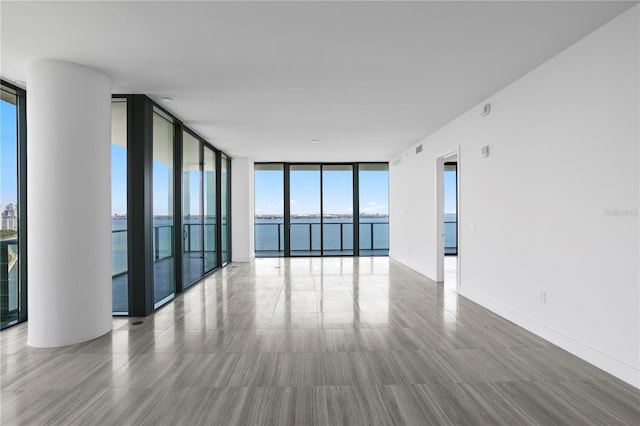 2912 W Santiago St Unit 1401, Tampa, FL 33629 - spare room featuring a water view, floor to ceiling windows, and visible vents
