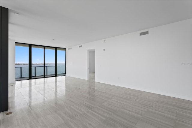 2912 W Santiago St Unit 1401, Tampa, FL 33629 - unfurnished room with a water view, visible vents, and expansive windows