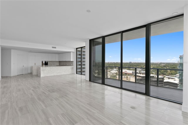 2912 W Santiago St Unit 1401, Tampa, FL 33629 - unfurnished living room featuring visible vents and floor to ceiling windows