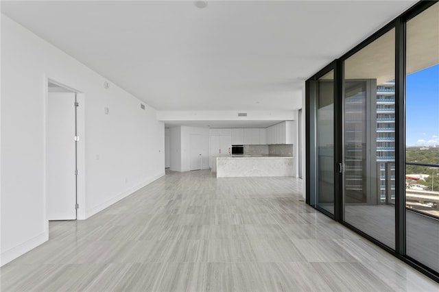 2912 W Santiago St Unit 1401, Tampa, FL 33629 - empty room with baseboards, a wall of windows, and visible vents