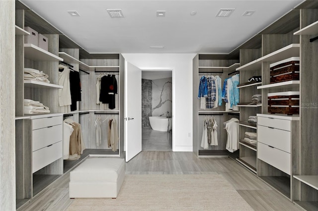 2912 W Santiago St Unit 1401, Tampa, FL 33629 - walk in closet with visible vents and light wood-style floors