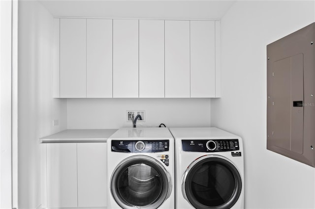 2912 W Santiago St Unit 1401, Tampa, FL 33629 - laundry room featuring electric panel, cabinet space, and washer and clothes dryer