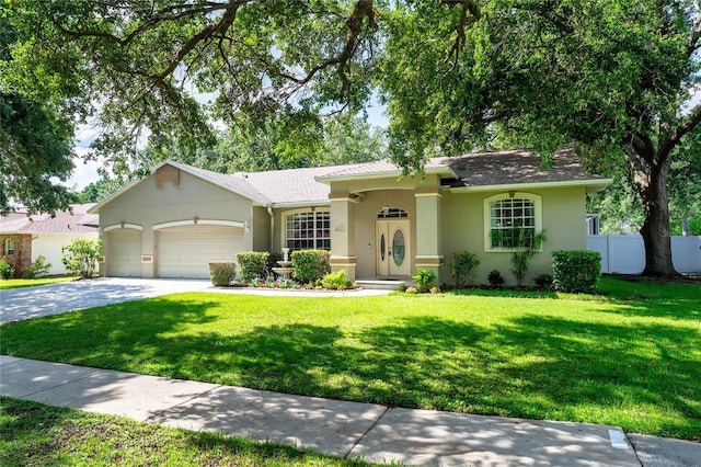 2803 Bent Leaf Dr, Valrico, FL 33594 - ranch-style house with an attached garage, stucco siding, and driveway