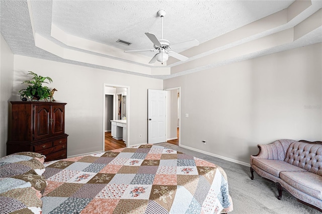 2803 Bent Leaf Dr, Valrico, FL 33594 - bedroom with a raised ceiling, a textured ceiling, baseboards, carpet floors, and ceiling fan