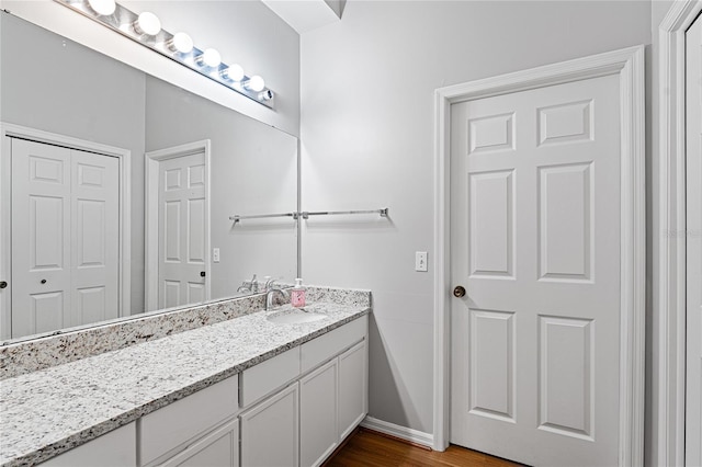 2803 Bent Leaf Dr, Valrico, FL 33594 - bathroom featuring vanity, baseboards, and wood finished floors