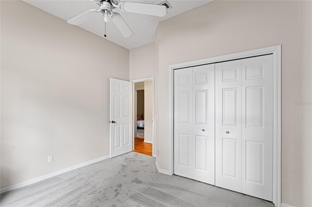 2803 Bent Leaf Dr, Valrico, FL 33594 - unfurnished bedroom with carpet, baseboards, a closet, vaulted ceiling, and a ceiling fan