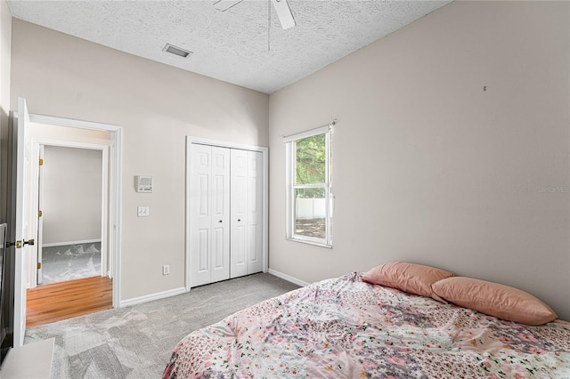 2803 Bent Leaf Dr, Valrico, FL 33594 - carpeted bedroom featuring baseboards, a closet, a ceiling fan, and a textured ceiling
