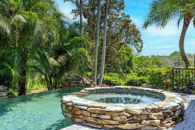 1058 Roundstone Pl, Palm Harbor, FL 34683 - outdoor pool with an in-ground hot tub