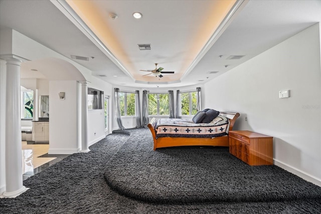 1058 Roundstone Pl, Palm Harbor, FL 34683 - bedroom featuring decorative columns, carpet flooring, a raised ceiling, and recessed lighting
