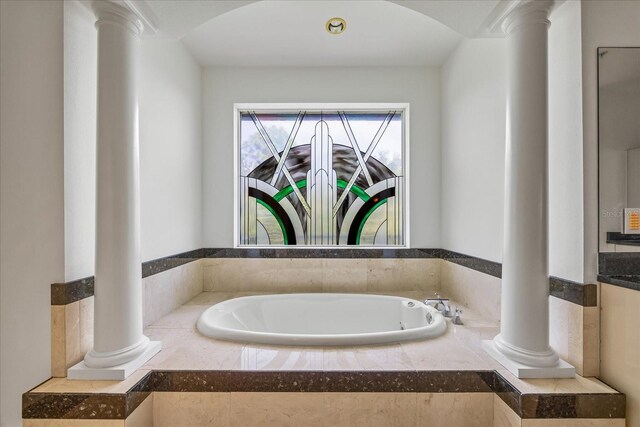 1058 Roundstone Pl, Palm Harbor, FL 34683 - bathroom with ornate columns and a garden tub