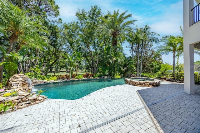 1058 Roundstone Pl, Palm Harbor, FL 34683 - view of swimming pool with a patio and a pool with connected hot tub