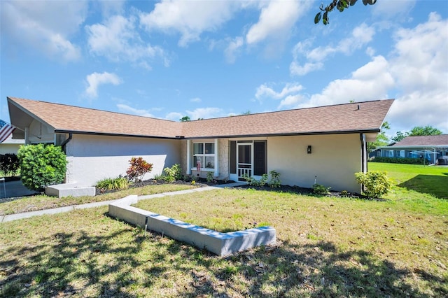 1657 Glengarry Dr, Palm Harbor, FL 34684 - ranch-style house with stucco siding and a front yard