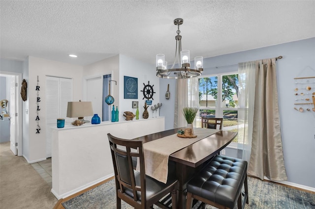 1657 Glengarry Dr, Palm Harbor, FL 34684 - dining area featuring an inviting chandelier, a textured ceiling, baseboards, and light carpet